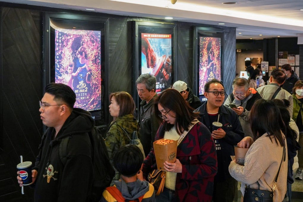 Moviegoers walked past posters for 2025 blockbusters Ne Zha 2 and Captain America: Brave New World at a cinema in Tsim Sha Tsui, Hong Kong. Photo: SCMP