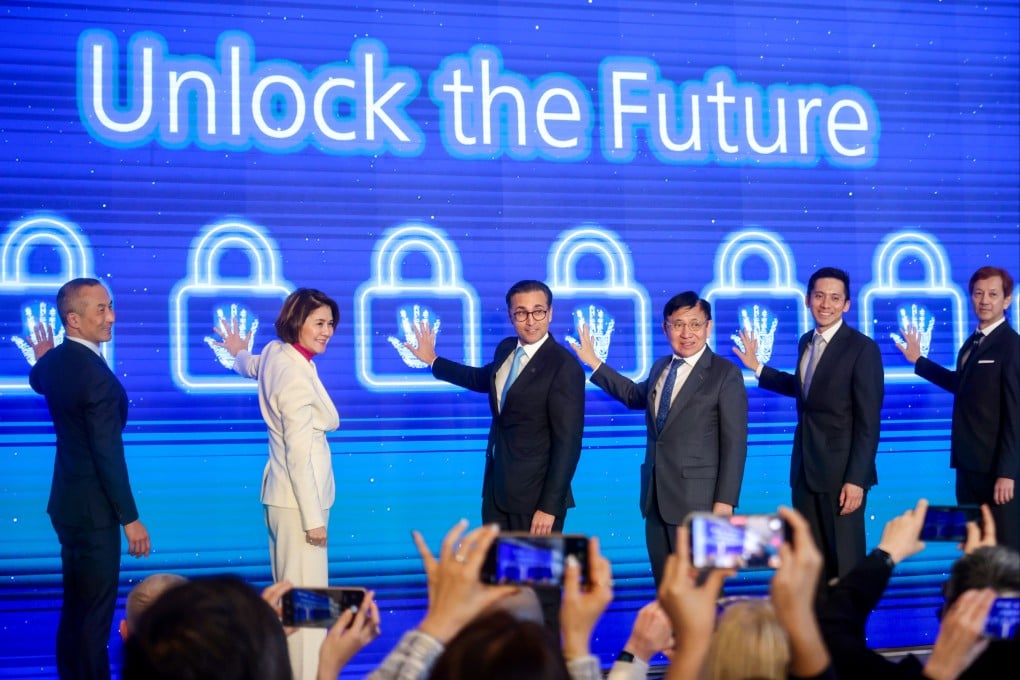 (Left to right) UBS’ Taichi Takahashi, Amy Lo, Iqbal Khan, and SHKP’s Raymond Kwok, Christopher Kwok and Eric Tung, at the UBS Tower Handover Ceremony at IGC on Tuesday, February 3, 2026.  Photo: Jonathan Wong