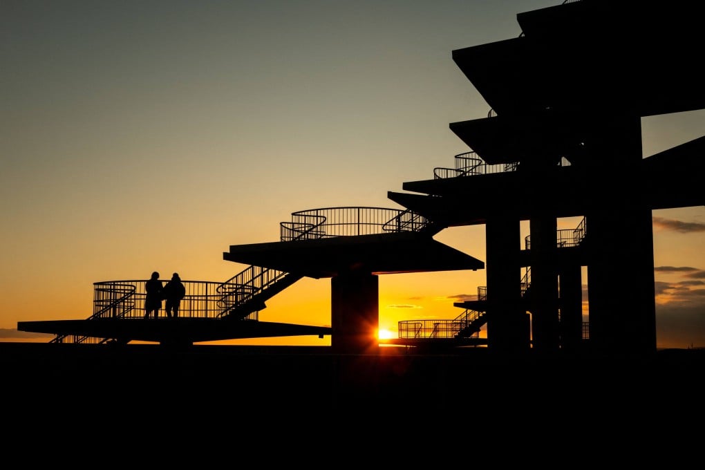 People visit an observation tower in a suburb of Tokyo on Monday. Japan is pushing to strengthen its laws against spying. Photo: AFP