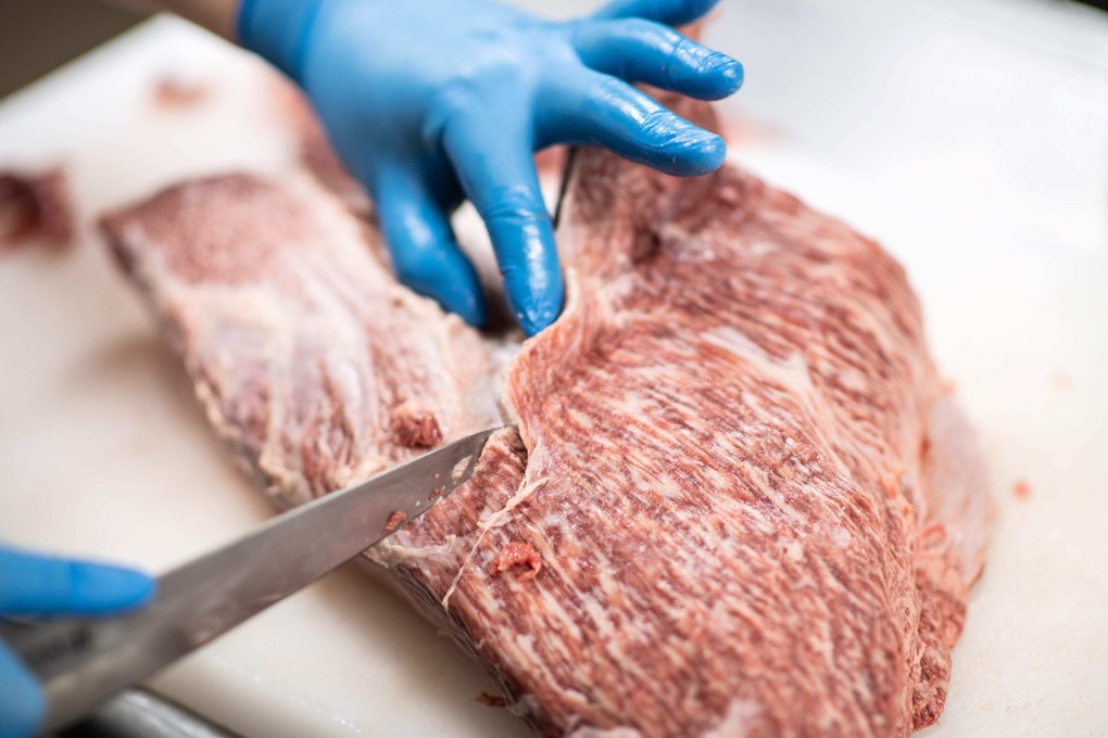 An employee slices wagyu beef to be served at a restaurant in Takayama. Japanese beef posted record export values last year. Photo: AFP