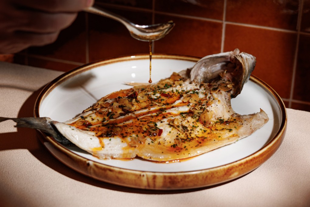 Spanish whole seabass at Aire in Hong Kong’s Causeway Bay neighbourhood, where Eric Chan enjoys casual Spanish food. The chef also shares where he goes in the city for Cantonese comfort food and flavours from his childhood. Photo: Aire