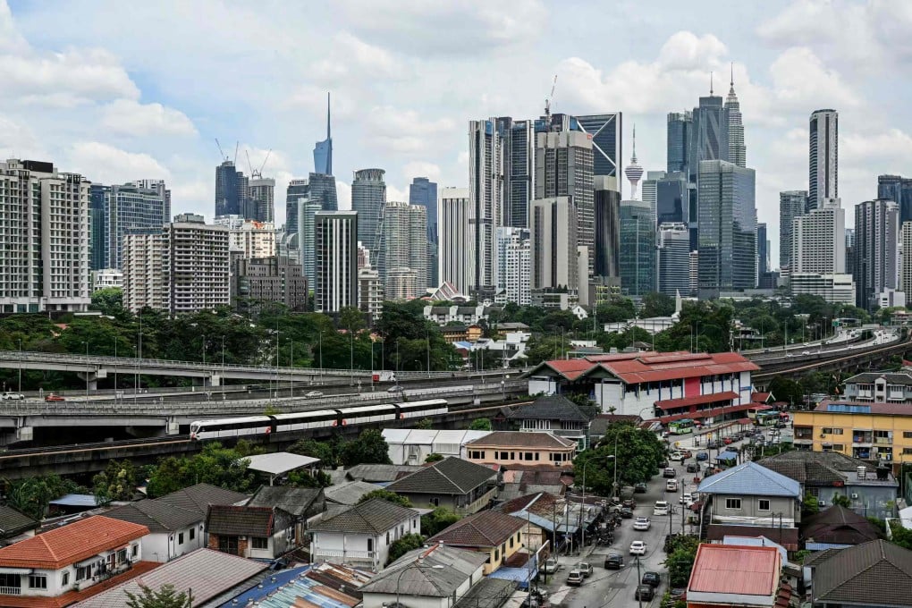 Commercial buildings and residential housing in Kuala Lumpur. MM2H homeowners tend to cluster around prime districts in the Malaysian capital. Photo: AFP