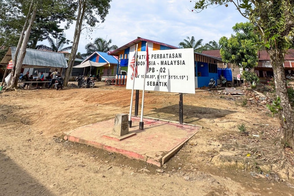 The Indonesia-Malaysia border marker on Sebatik Island, which is split between Indonesia’s Nunukan regency and Malaysia’s Tawau district. Photo: Shutterstock