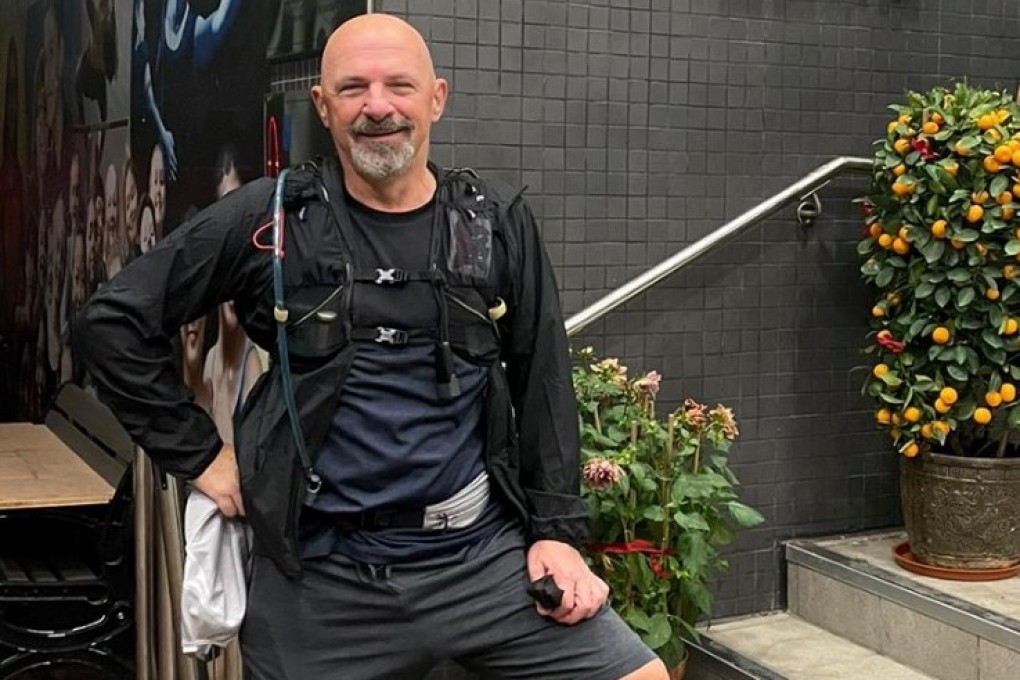 Tony Bruno pauses in front of West Island School during the first Weez Walk, which he completed on his own, in 2021. He launched Weez Walk to raise funds for mental health support in Hong Kong to honour the memory of his son. Photo: weezproject.com