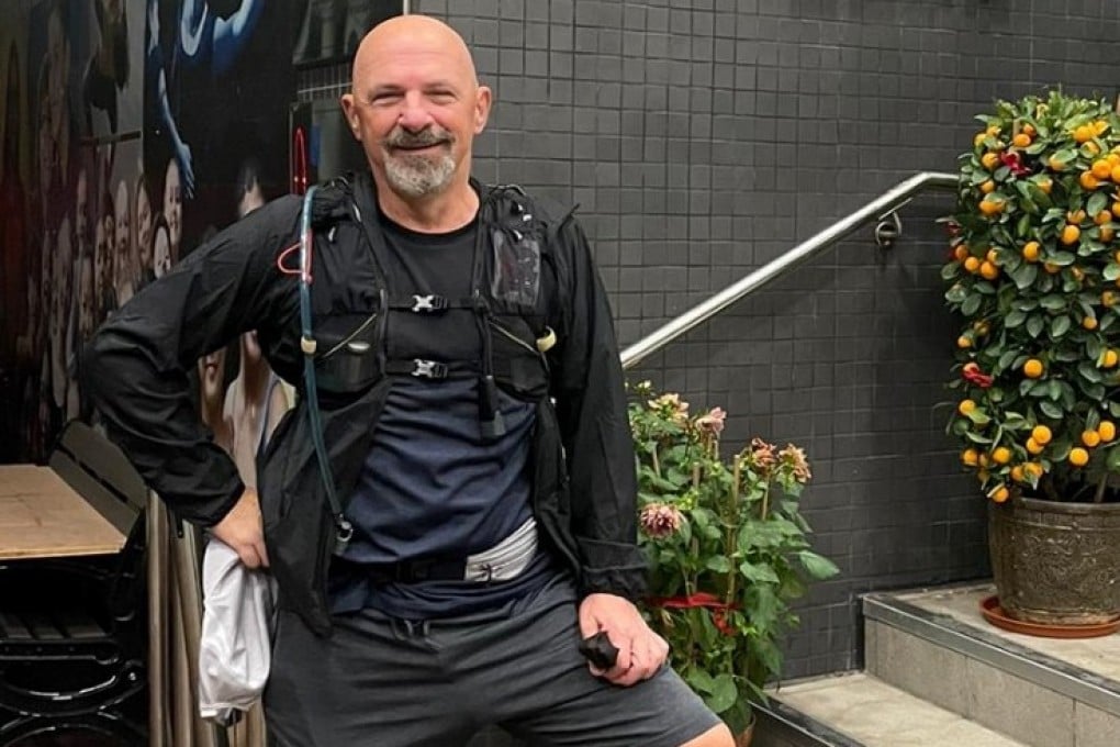Tony Bruno pauses in front of West Island School during the first Weez Walk, which he completed on his own, in 2021. He launched Weez Walk to raise funds for mental health support in Hong Kong to honour the memory of his son. Photo: weezproject.com