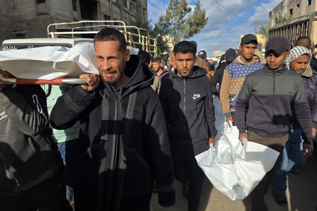 Palestinians carry the bodies of three people killed in an Israeli strike on their displacement tent on Wednesday. Photo: dpa