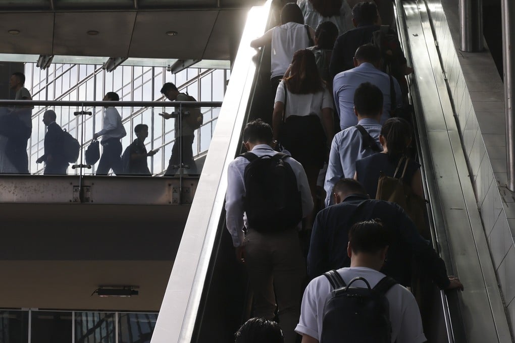 People go to work in Central district during the morning rush hour on July 17. University graduates in Hong Kong are facing the gloomiest employment market since 2021. Photo: Nora Tam