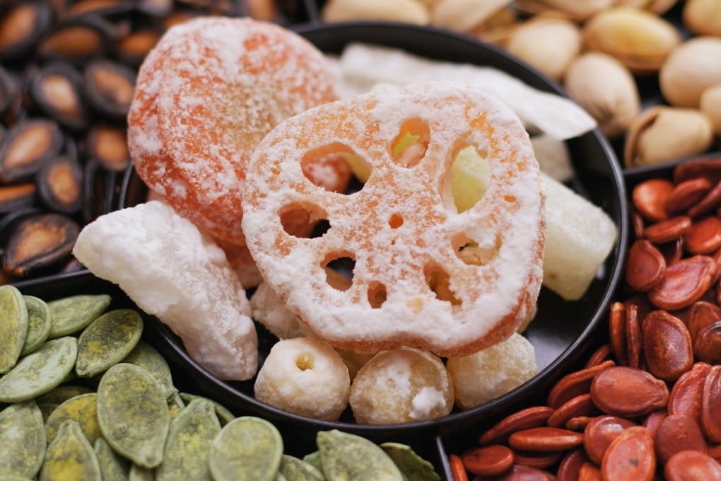 A tray of Lunar New Year snacks. Many Chinese communities enjoy the same festive favourites at this time of year, but places such as Singapore and Malaysia also gorge on regional treats shaped by foreign influences and migration. Photo: Getty Images