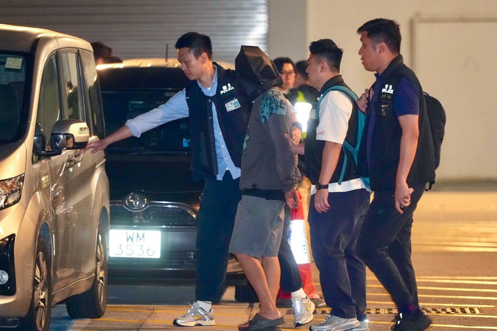 Officers escort the murder suspect to the Airport Police Station in Hong Kong. Photo: Sam Tsang