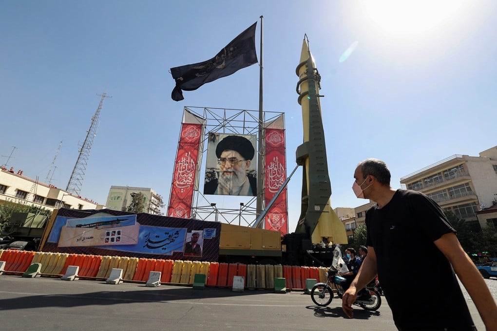 A Shahab-3 missile is displayed next to a portrait of Iranian Supreme Leader Ayatollah Ali Khamenei in Tehran in September 2021. Photo: TNS