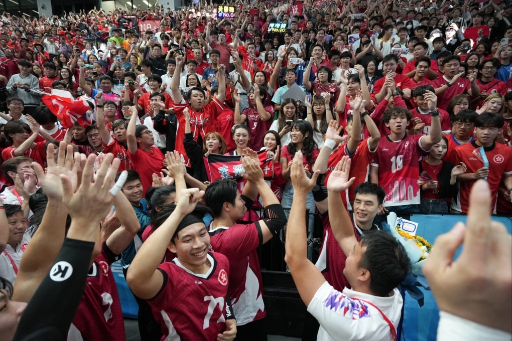 Hong Kong;s men celebrate with fans at Kai Tak Arena after a National Games clash with Beijing. Photo: Eugene Lee