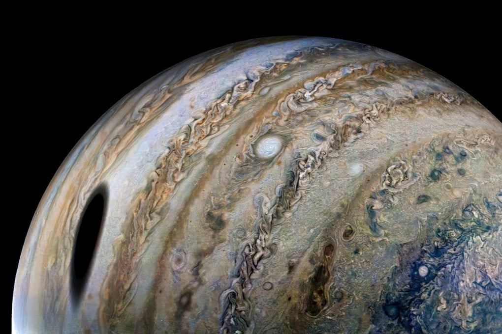 An enhanced-colour image, using raw data from the Juno spacecraft, shows Jupiter with the shadow of its moon Ganymede on the left. Image: Nasa/JPL-Caltech/SwRI/MSSS via Reuters