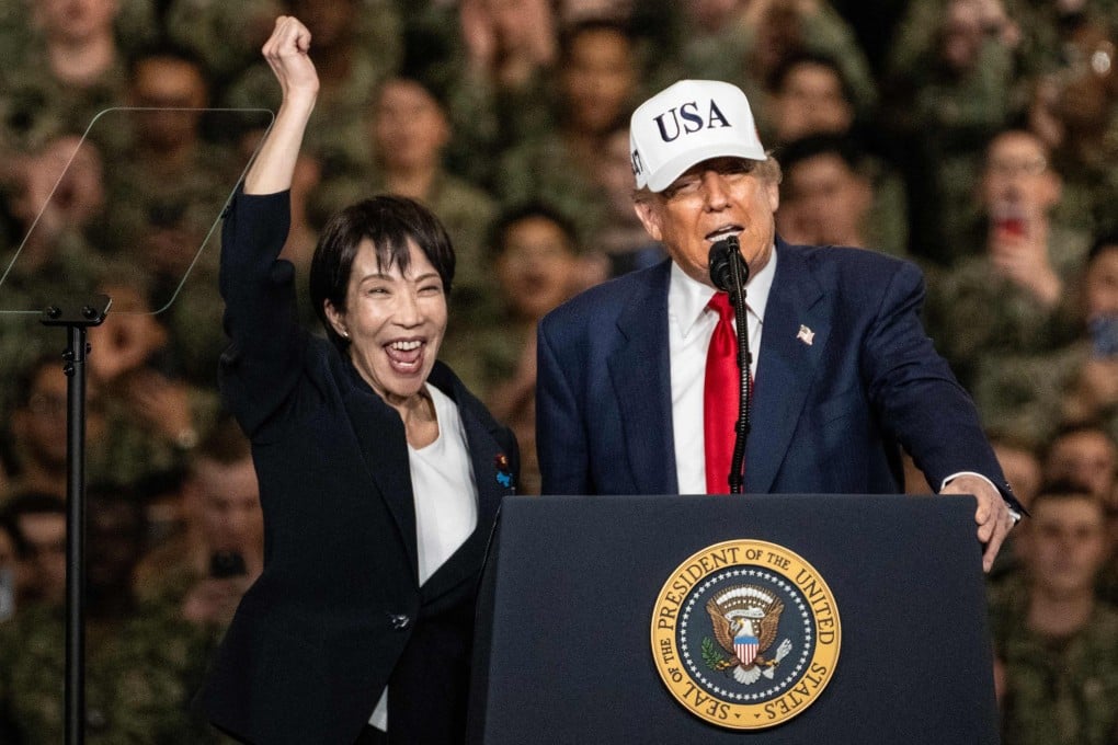 Japan’s Prime Minister Sanae Takaichi, (left) gestures as US President Donald Trump delivers a speech in front of US Navy personnel at the US naval base in Yokosuka, Japan, on October 28, 2025. Photo: AFP