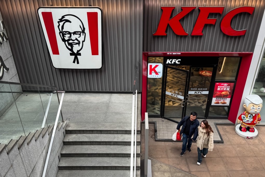 A couple walks out of a KFC restaurant in an urban shopping district on February 22, 2025, in the southwestern Chinese city of Chongqing. Photo: Getty Images