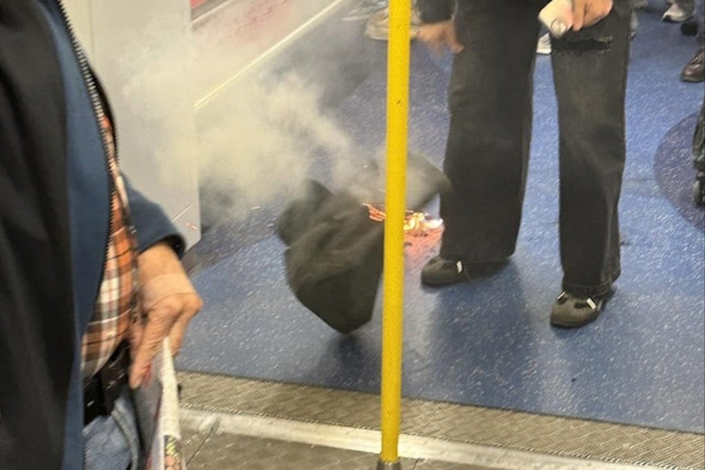 Footage circulating online appears to show a black bag on fire and emitting thick white smoke inside a train carriage. Photo: Threads/kenophk2001