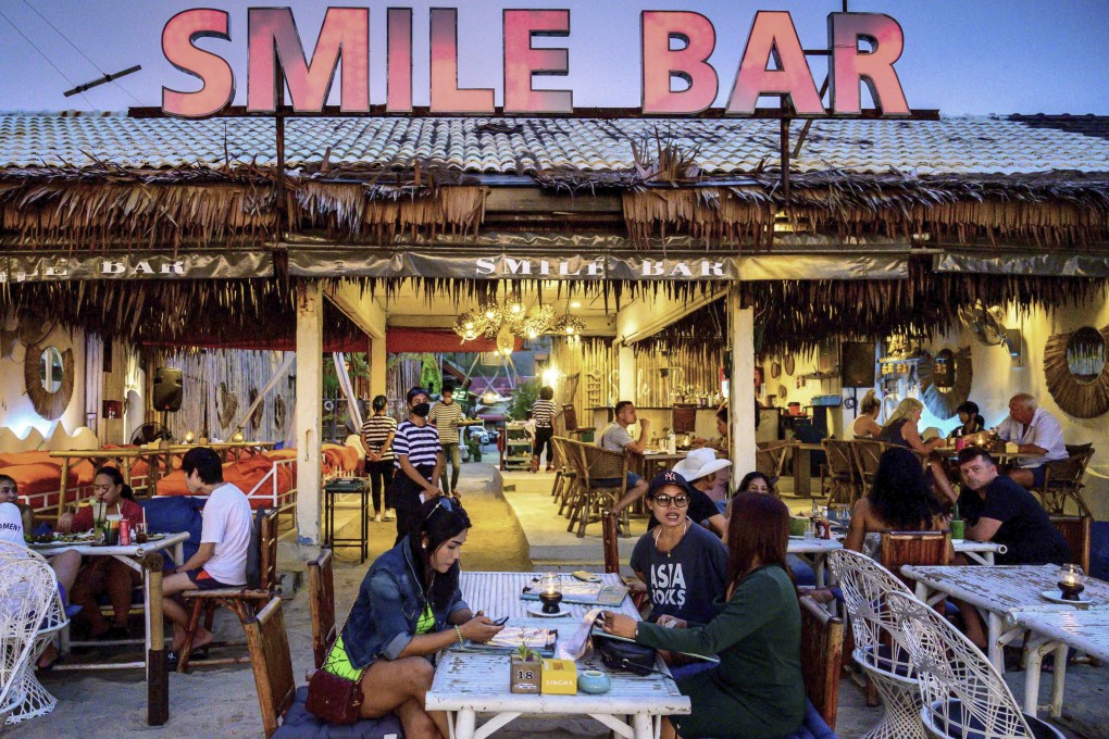 People sit in a bar on the Thai island of Phuket. Photo: AFP