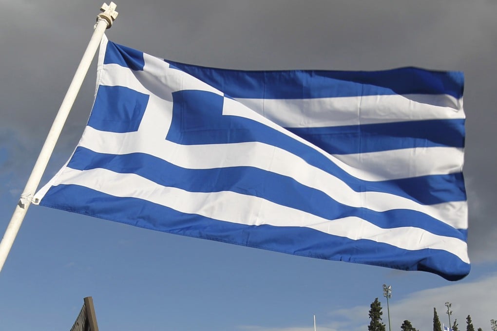 Greece’s flag. On Thursday, a member of Greece’s military was arrested for espionage with suspected links to China. Photo:: AP