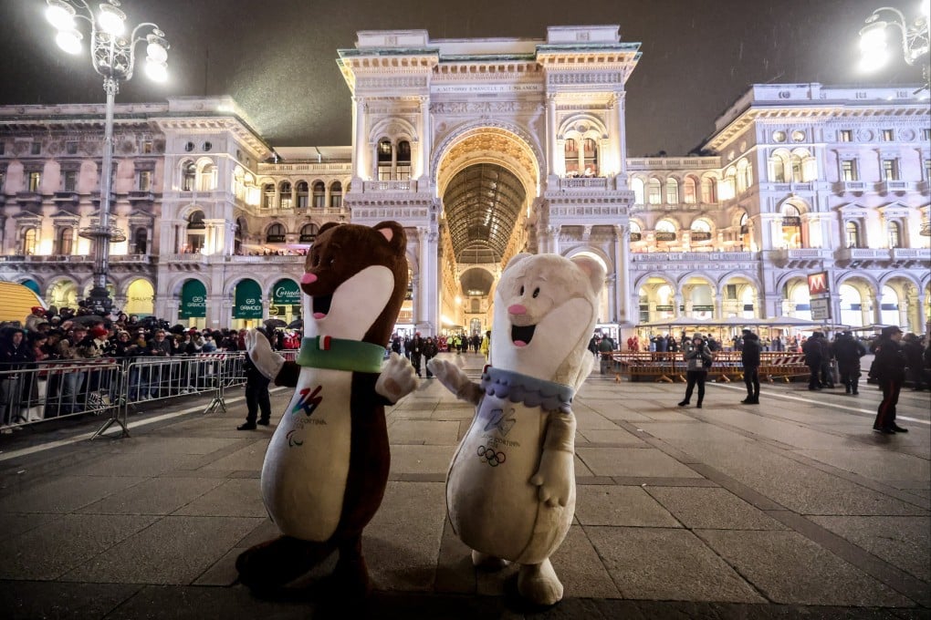 Tina and Milo, the official mascots of Milano Cortina 2026, dancing before the arrival of the Olympic torch in Milan’s Cathedral Square on the eve of the Winter Olympics opening ceremony on Friday. Photo: EPA