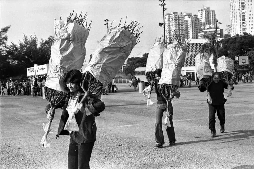 Women with peach blossoms they bought at a flower market in January 1979. Photo: SCMP Archives
