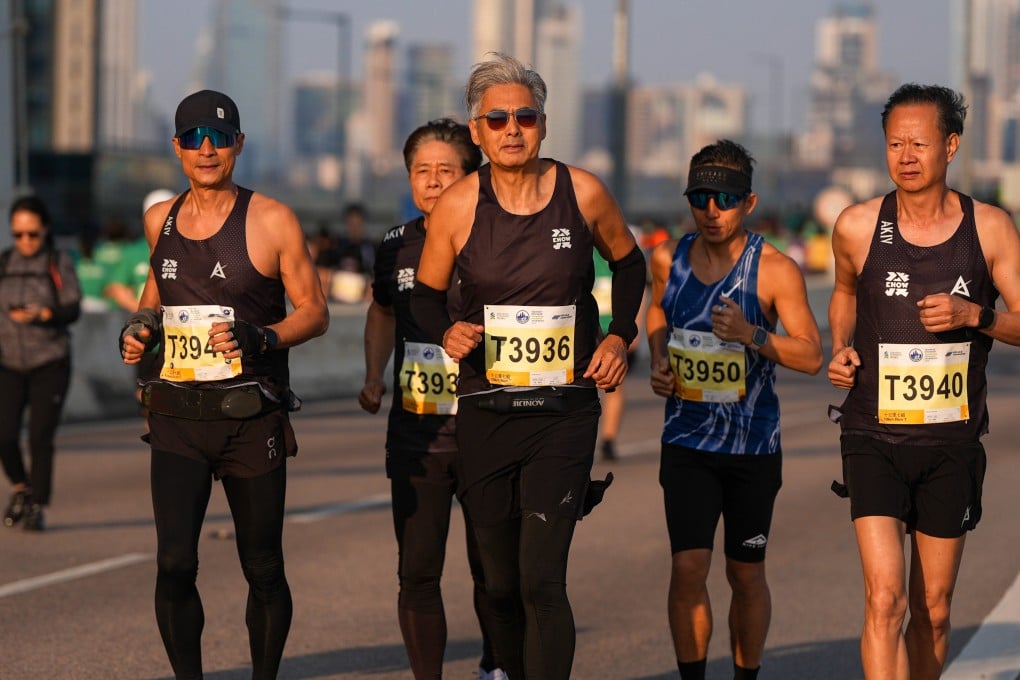 Actor Chow Yun-fat (middle) runs in the 10km event at the Standard Chartered Hong Kong Marathon 2026. The 70-year-old is part of a growing number of older people competing in endurance races. Photo: Eugene Lee