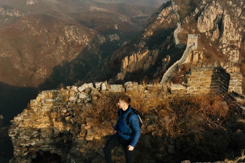 Ash Dykes walks along the Great Wall of China in a still from his new BBC series, The Great Wall with Ash Dykes. Photo: Bomanbridge Media