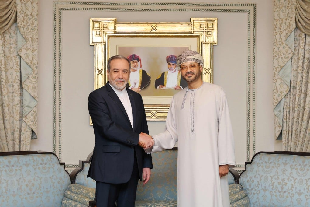 Oman’s Foreign Minister Badr al-Busaidi (right) with his Iranian counterpart Abbas Araghchi in Muscat on Friday. Photo: Omani Foreign Ministry/AFP