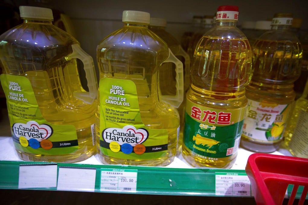 Bottles of Canola Harvest brand canola oil, made by a Canadian agribusiness firm, are seen on the shelf of a grocery store in Beijing. Photo: AP