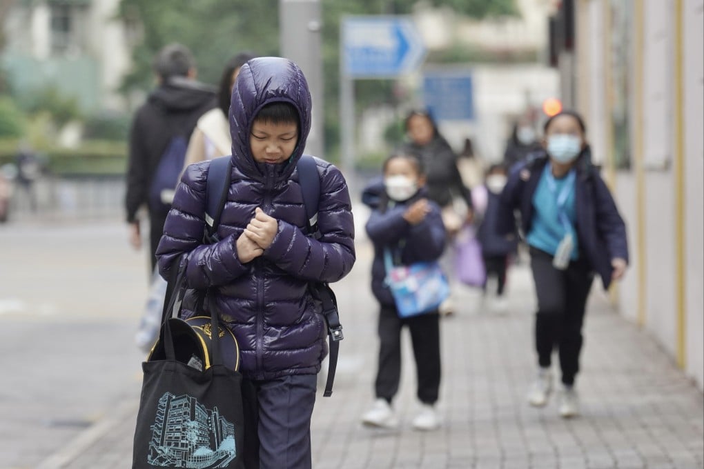 Students go to school on a chilly morning in Hung Hom on January 7. Photo: Karma Lo