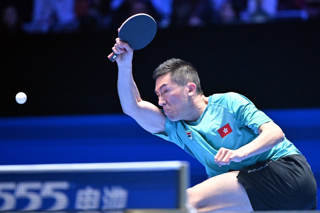 Hong Kong’s Lam Siu-hang hits a return during his singles group match against Uda Yukiya of Japan on Wednesday. Photo: Xinhua