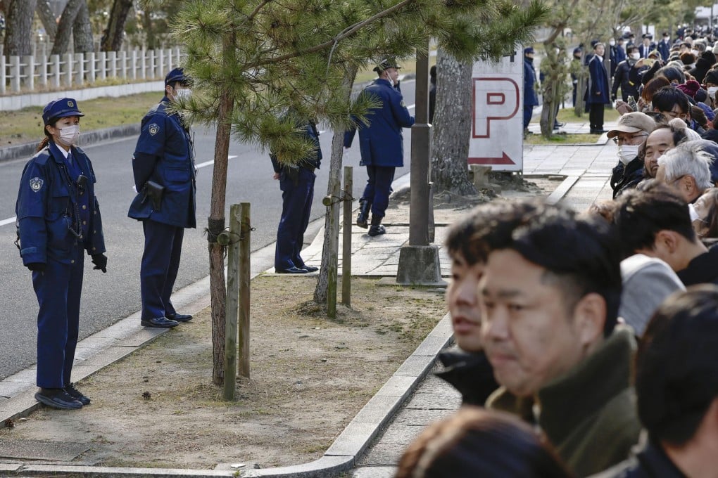 Police officers stand guard near the Horyuji Temple in Ikaruga, Nara prefecture on January 14. Photo: Kyodo/AP