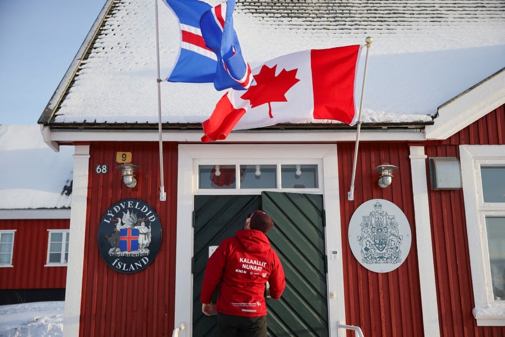 A person stands outside Canadian consulate in Nuuk, Greenland, on Friday, the day of its official oppening. Photo: Reuters