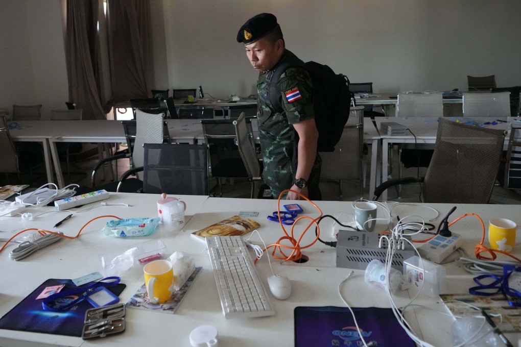 A Thai solider inspects a workstation inside a scam centre in O’Smach, Cambodia, on Monday. Photo: AP