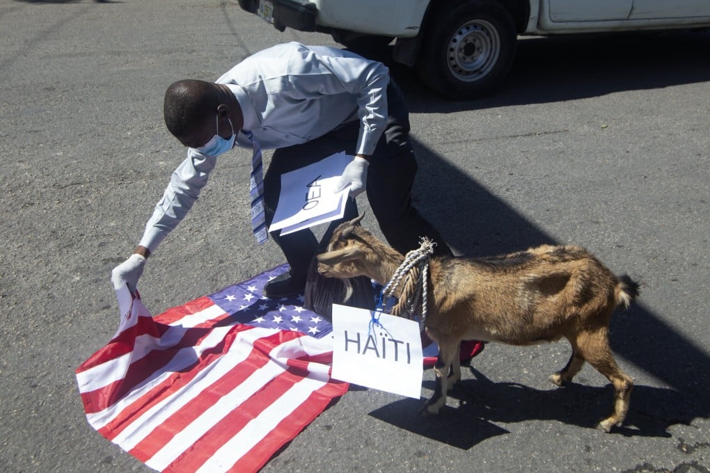 A man tramples on a US flag during a protest in Port-au-Prince, Haiti, on Friday. Photo: EPA-EFE