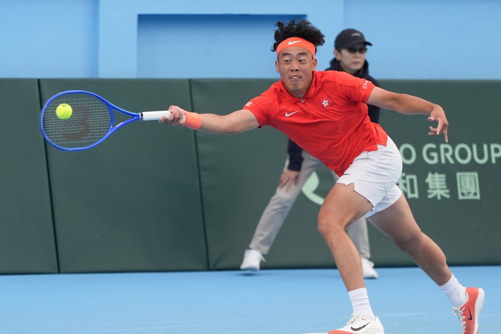 Coleman Wong scrambles to reach a forehand against Otto Virtanen on a difficult day for the Hong Kong No 1. Photo: Eugene Lee