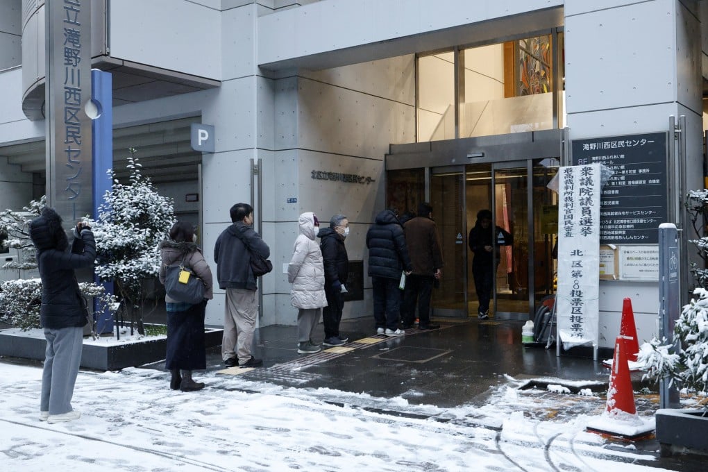 Voters line up at a polling station in Tokyo, Japan, on Sunday. Photo: EPA