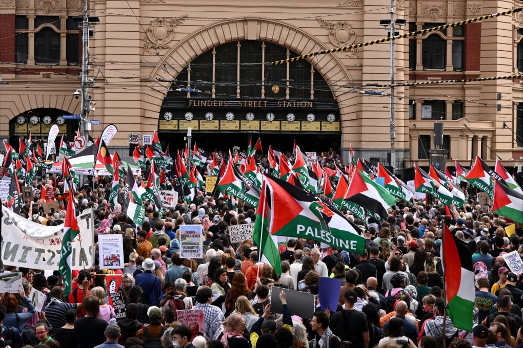 Protesters gather outside Flinders Street Station in Melbourne. Photo: EPA