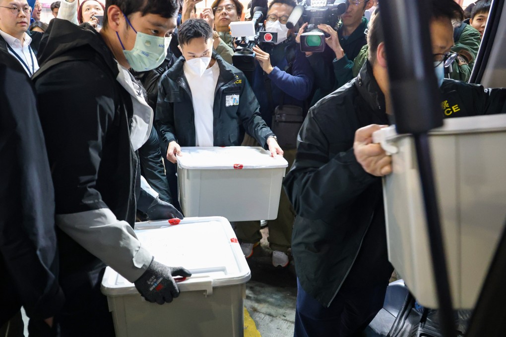 Officers from the commercial crime bureau searched the lawyer’s office in Mong Kok on Monday night, leaving with about 10 boxes of documents. Photo: Handout