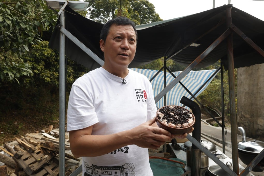Tsang Wai-yip, the village chief of Hong Kong Hakka village Lai Chi Wo, holds a traditional Hakka pork bowl as part of the “Lai Chi Wo Chronicles: Village Culture & Archives Exhibition”. It is one of two current projects in Hong Kong aiming to shed light on the culture of the Hakka people. Photo: SEE Network