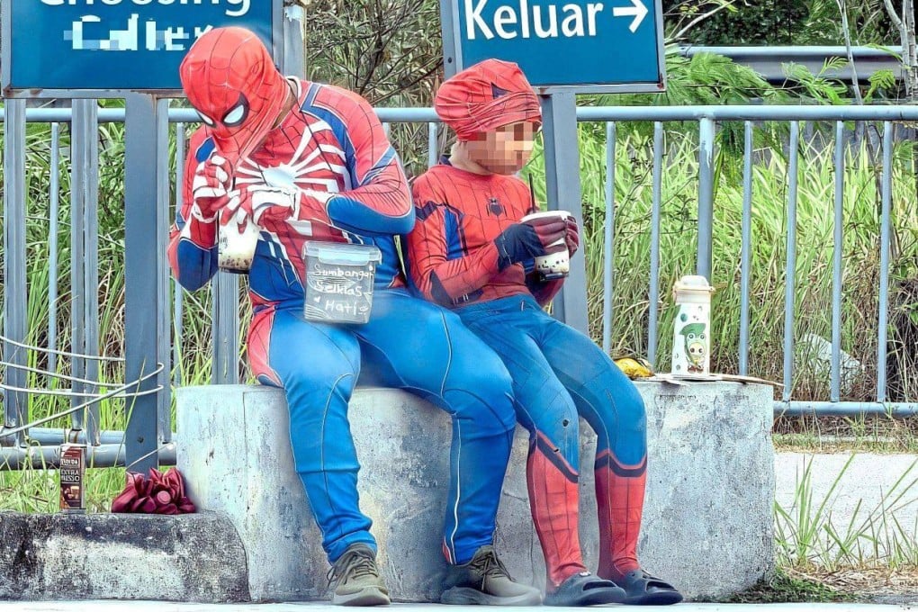 The man who was wearing a Spider-Man costume and the young girl were spotted at a petrol kiosk in Cheng, Malaysia’s Melaka state. Photo: The Star