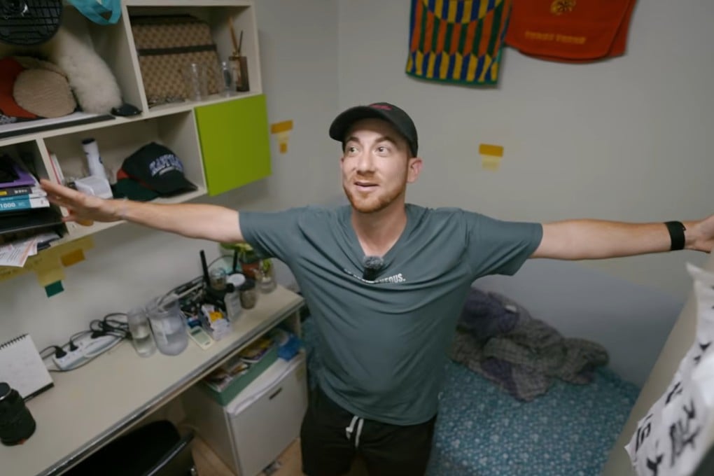 Drew Binsky inside a Seoul gosiwon on February 1, his outstretched arms nearly spanning the narrow room. Photo: YouTube/Drew Binsky