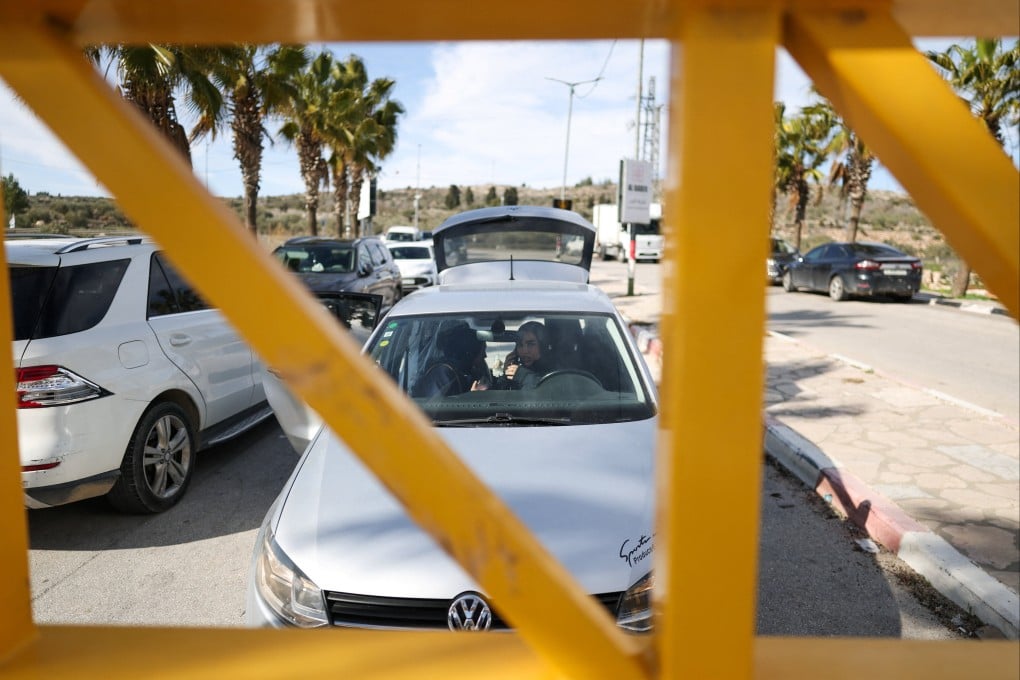 Palestinians sit in a car in front of a closed Israeli gate near Ramallah in the Israeli-occupied West Bank earlier this month. Photo: Reuters