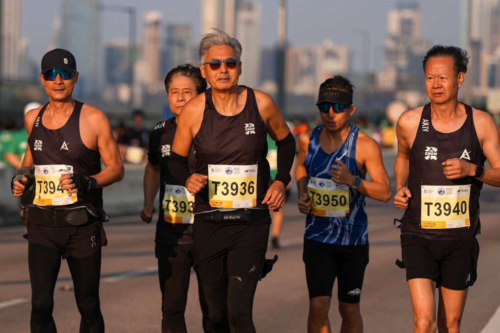 Actor Chow Yun-fat (middle) runs in the 10km event at the Standard Chartered Hong Kong Marathon 2026. The 70-year-old is part of a growing number of older people competing in endurance races. Photo: Eugene Lee