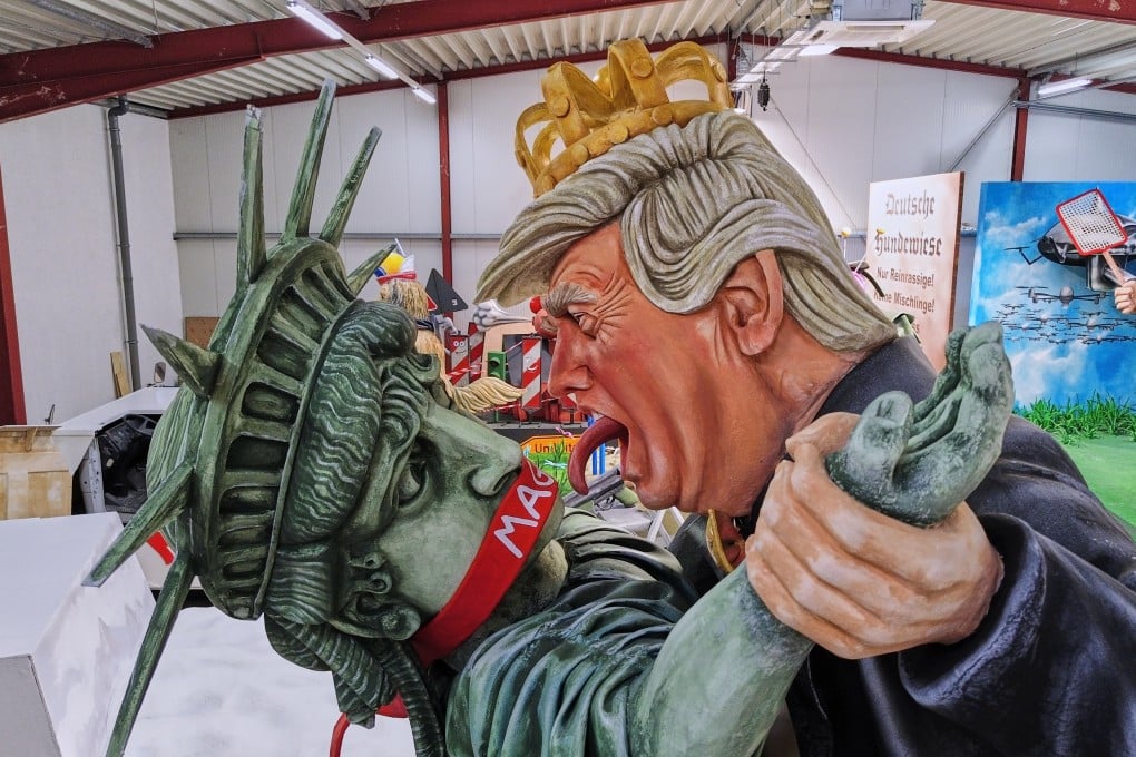 A carnival float featuring a figure of US President Donald Trump dancing with the Statue of Liberty is unveiled for the Mainz carnival in Germany on Tuesday. Photo: AP