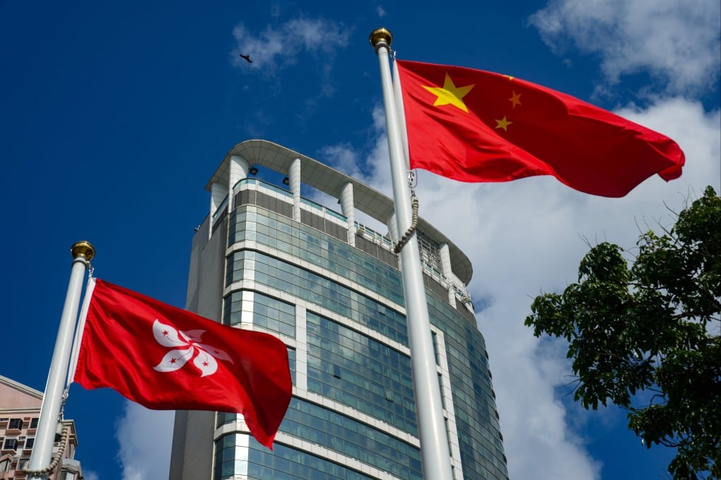 The Hong Kong Special Administrative Region and Chinese national flags fly in front of the building housing the Office for Safeguarding National Security in Tin Hau in May 2025. Photo: Sam Tsang