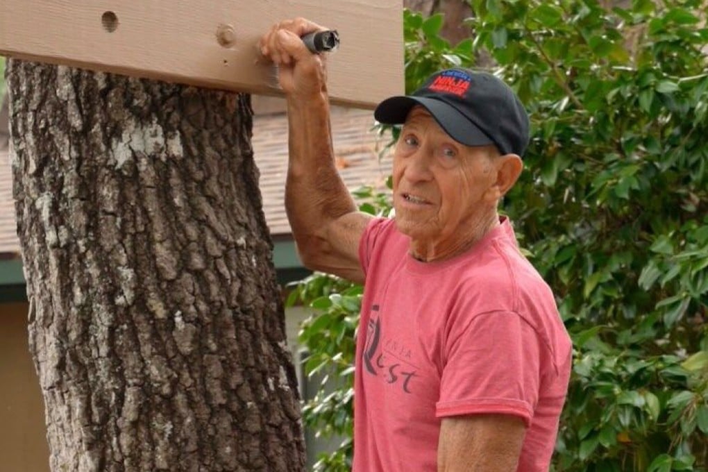 Charles Mammay prepares to exercise in the obstacle course he built in the front garden of his home in Oak Island, in the US state of North Carolina, in 2025. Photo: Instagram/charlesmammay