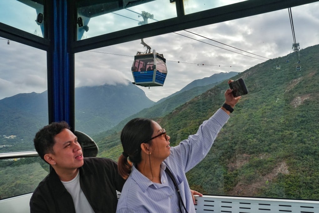 Passengers enjoy a ride on the Ngong Ping 360 cable car. Photo: Elson Li