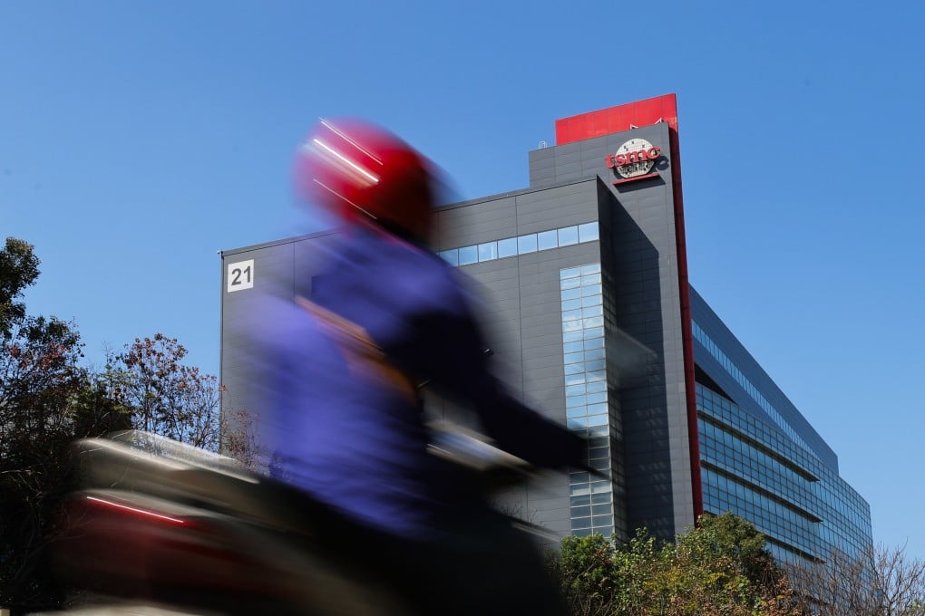 A motorcyclist rides past the TSMC logo outside its building in Hsinchu, Taiwan, February 10, 2026. Photo: EPA