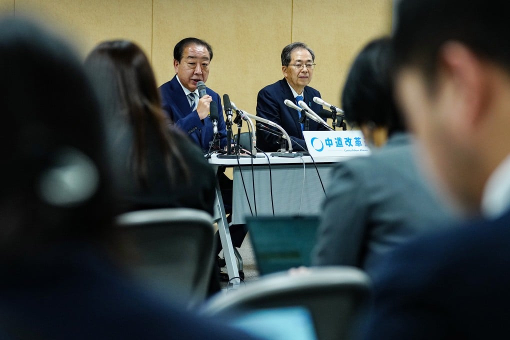 Yoshihiko Noda (left) and Tetsuo Saito announce their resignation as co-leaders of the opposition Centrist Reform Alliance at a press conference in Tokyo on Monday. Photo: Xinhua