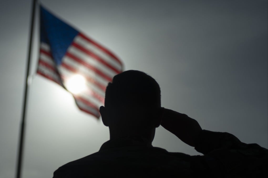 A US Air Force officer salutes the flag at Camp Simba, Manda Bay, Kenya, in 2019. Photo: US Air Force/AP