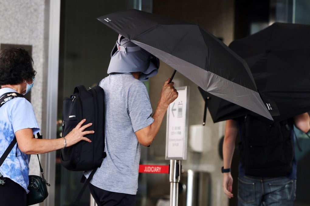 Kwok Yin-sang (centre) arrives at the West Kowloon Court during the trial in October last year. Photo: Edmond So
